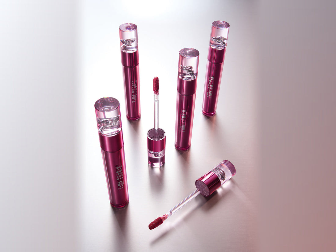 Altera Blurring Lip Tint with applicator beside lips wearing a soft-focus velvet matte finish.
